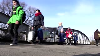 Fleeing war, people cross into Romania from Ukraine