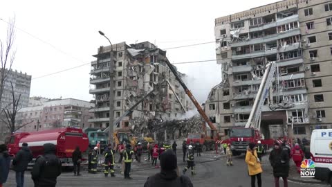 Crews rescue woman from rubble of Ukraine apartment building