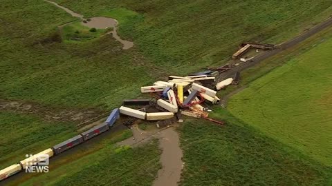 Freight train derails, causes tens of carriages piled up on tracks _ 9 News Australia