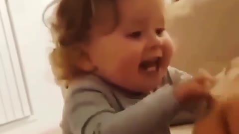 A little girl trying to make her father laugh in a funny way so cute