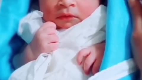 a new born baby after his birth crying laoudaly