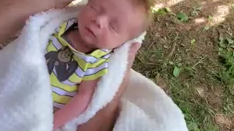 New born baby boy enjoys head massage