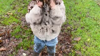 Little Girl Puts on a Mud Mask