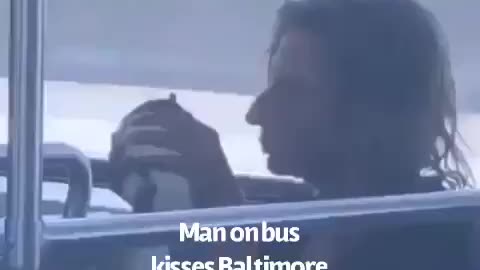 Man on bus kisses Baltimore politician