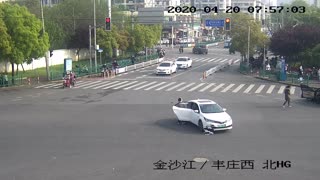 Woman Falls Out Of Car While Reversing At Crossroads