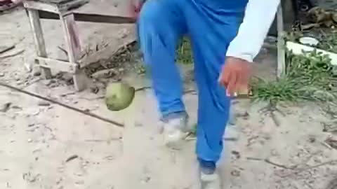 Man doing maneuvers with a coconut