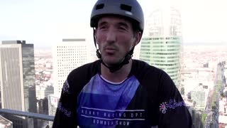 French athlete climbs 33-storey tower on his bike