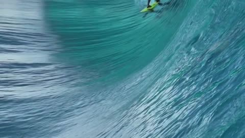 DRONE VIEW OF MATAHI DROLLET AT TEAHUPOO HUGE TOW IN WAVE IN SLOWMOTION