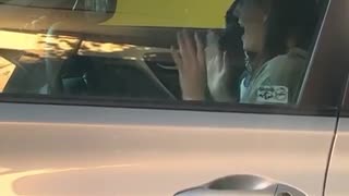 Woman Caught Excitedly Dancing in Car