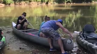 Canoe Slams Into Rocks After Being Launched Backwards