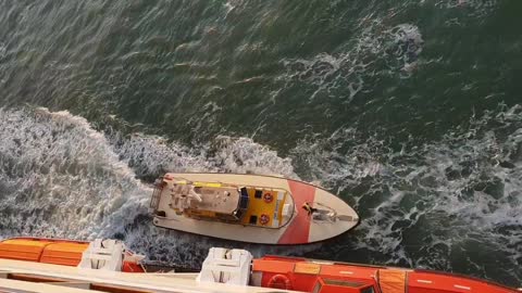 Daring Jump from Ocean Liner to Power Boat