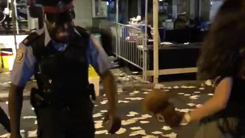 Cop and lady were dancing in festival street food