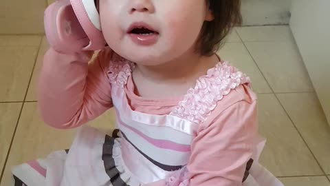 Adorable toddler uses shoe as personal telephone