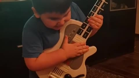 little guitar player