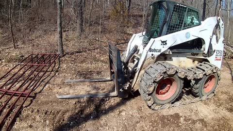 Putting up a gate on the driveway.