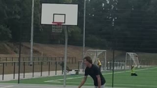 Guy white shorts basket ball falls on back