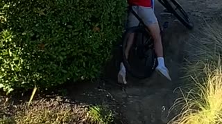 Mountain Biker Can't Quite Make It Up Small Hill