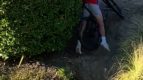 Mountain Biker Can't Quite Make It Up Small Hill