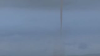 Waterspout Funnels Fill Horizon During Storm