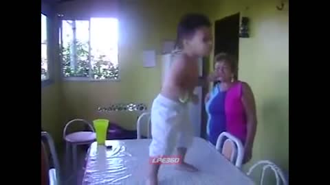 Little Boy Dances On Table