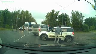 Armored Vehicle Hits Car in Intersection