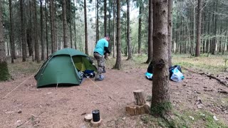 Tidying up to break down the tent while wildcamping