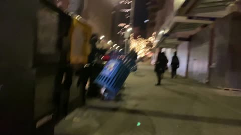 ANTIFA picking up trashcan