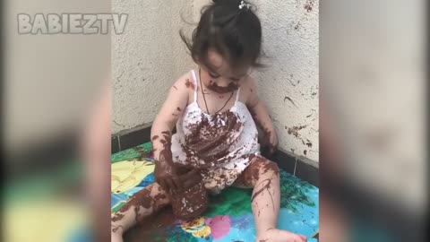 Little Baby Playing With A Jar Of Nutella