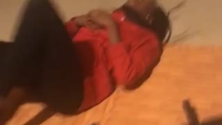 Red shirt girl falls off pullup bar onto butt