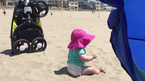 Baby On Beach Crams Cigarette Butt Into Her Mouth