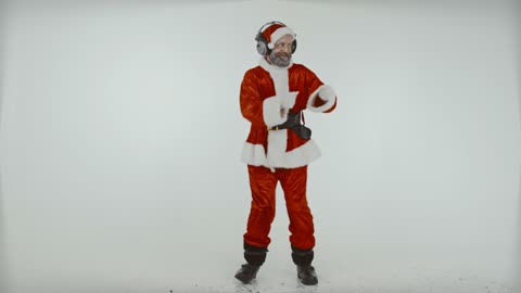 Man in Santa Claus Costume Dancing with Headphones