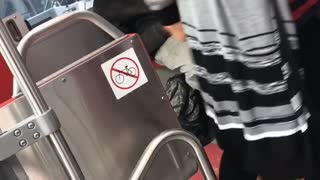 Man with long beard dances sitting down train