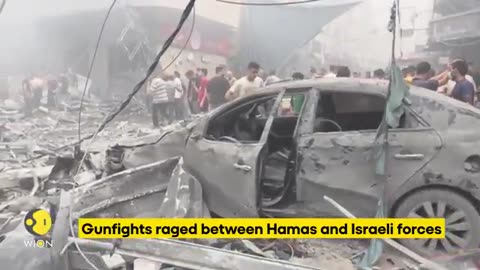 Israel - Palestine war: Palestinians stand amidst rubble as they witness live airstrike