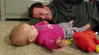 Baby hilariously anticipates dad's tickles