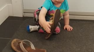 Baby girl trying sandals for the first time
