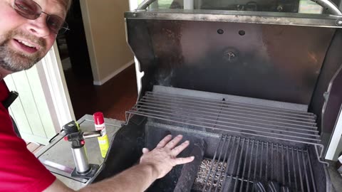 Using a pellet tray to make a gas grill taste like a charcoal grill