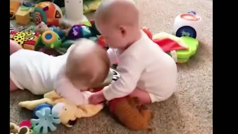Lovely twins play together