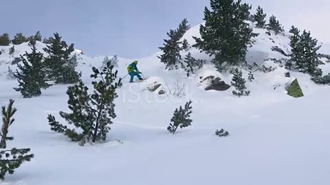 Extreme male skier riding off piste jumps and crashes into the fresh powder snow stock video