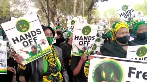 Supporters from the ANC sing outside the Bloemfontein magistrates court