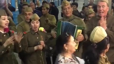 Russian soldiers sing "Katiyusha" (Katijusza) in a railway station