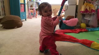 Baby Girl Pretends To Pole Dance While Dad Mutters "Oh no" To Himself