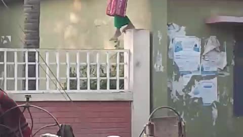 See how the girl climbs from the roof to the ladder