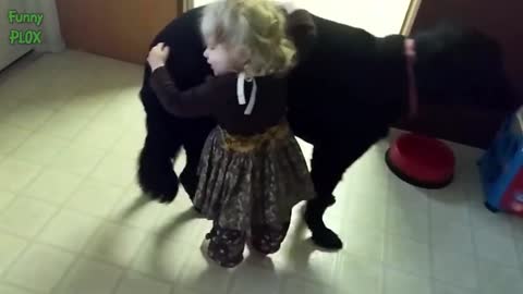 small girls hugs the dog