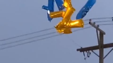 Balloons hitting powerlines