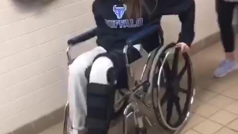 Girl broken leg wheel chair falls backwards wheelie
