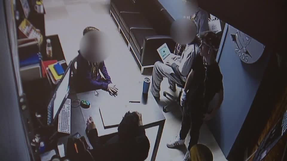 Surveillance video shows Warren De La Salle student walking through school with a knife