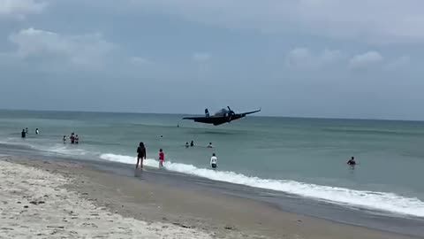 WWII plane forced to crash land on busy Florida beach