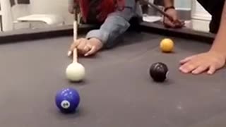 Red hair girl misses purple ball in pool