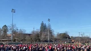 An enthusiastic crowd chants ahead of President Donald Trump’s rally