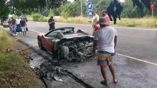 A red Ferarri goes up in flames on the M4